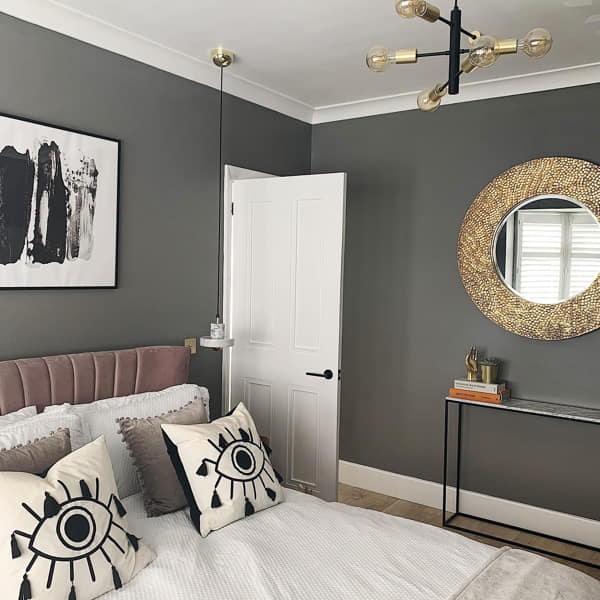 Small Bedroom with Dark Walls and Feature Wall Mirror