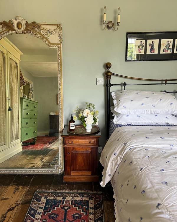 Old House Bedroom Design with Green Walls and Tall Mirror